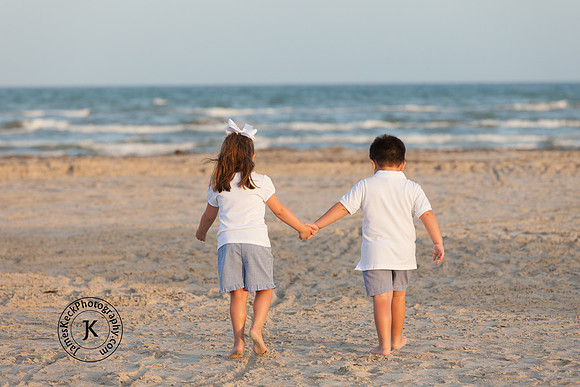 Brother and Sister Holding Hands on the Beach Portrait