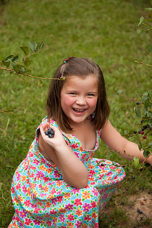 Audrey Holding up Blueberries