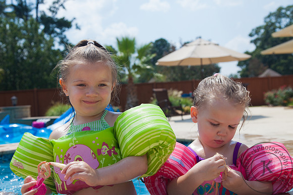 Cousins Swimming in the Pool