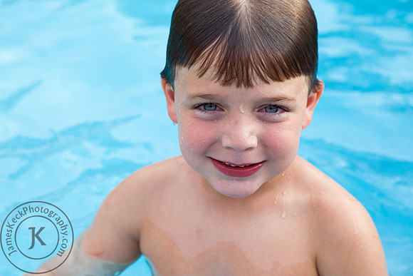 Little Boy Smiling in Swimming Pool