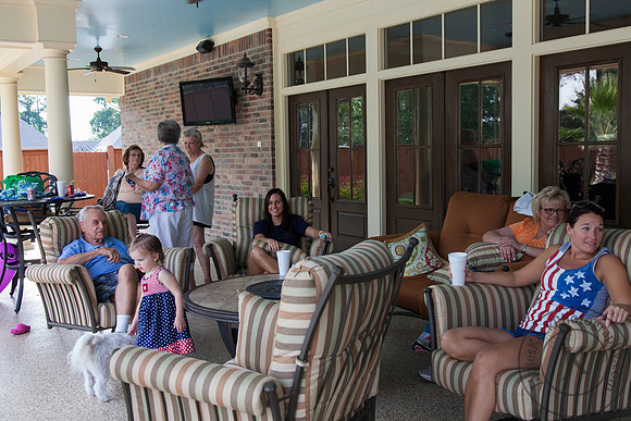 Family Talking Next to Pool