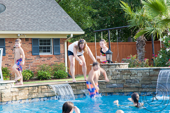 Woman Throwing Boy into the Pool