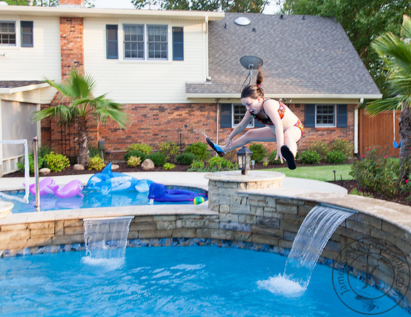 Girl Jumping into the Pool