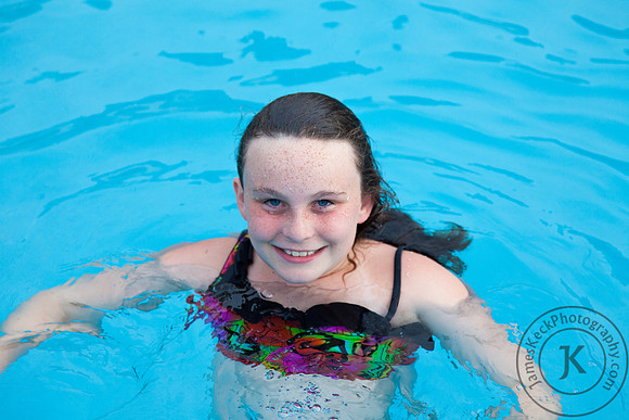 Girl Smiling in Pool