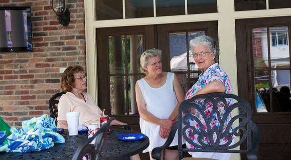 Family Talking Next to Pool