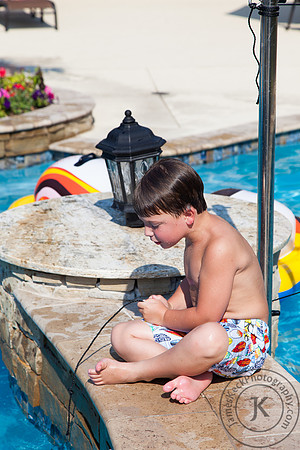 Portrait of Boy Fishing in the Pool