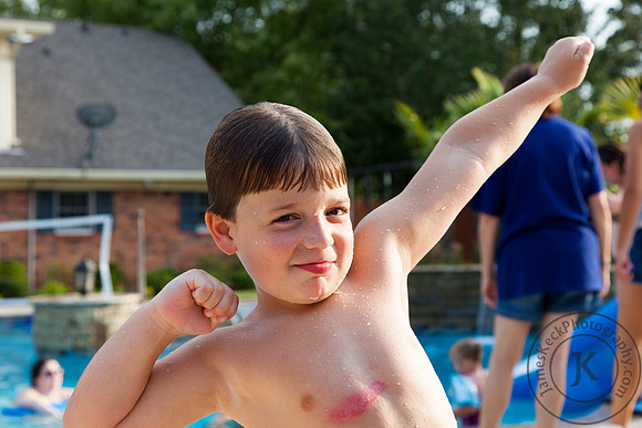 Little Boy Posing Next to the Pool
