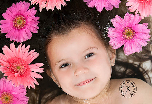 Portrait of Girl with Gerbera Daisies in Bathtub