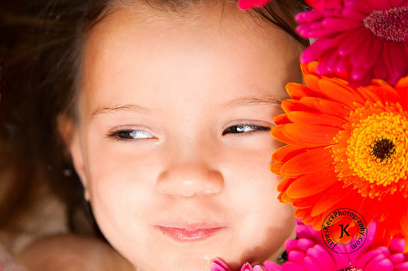Portrait of Girl with Gerbera Daisies in Bathtub