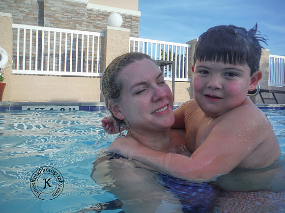 Portrait of Mother and Son in Swimming Pool