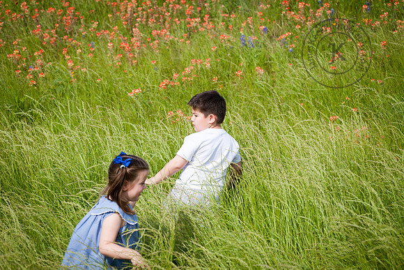 Portrait of Children Running through Wildflowers