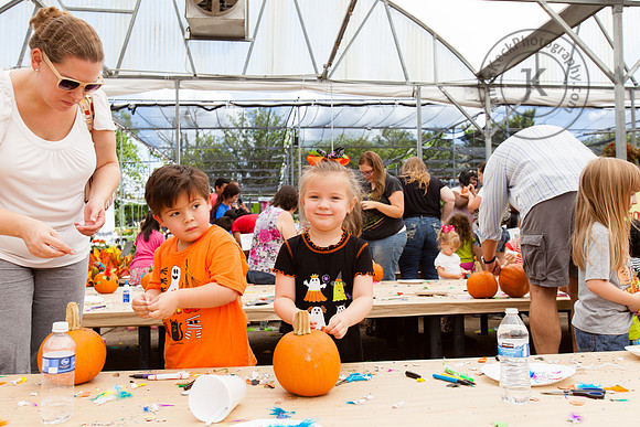 Portrait of Boy and Girl Decorating Pumpkins