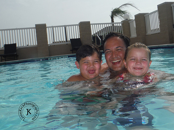 Father, Son, and Daughter in Swimming Pool