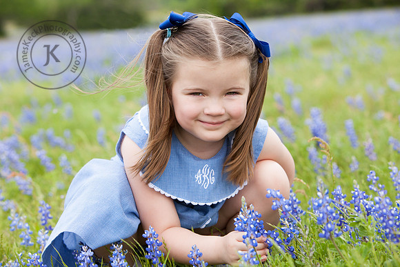 Portrait of Girl Picking Bluebonnets