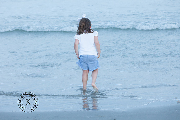 Portrait of Little Girl Wading in the Water at the Beach