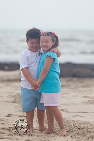 Portrait of Brother and Sister Hugging on the Beach