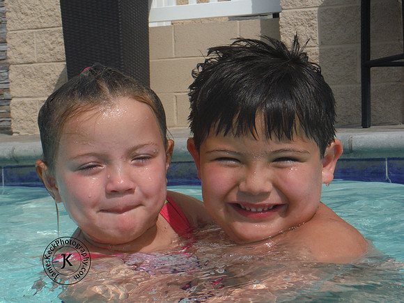 Portrait of Brother and Sister in Swimming Pool