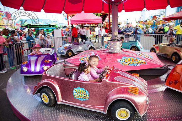 Audrey Riding Carnival Racecar at Houston Rodeo