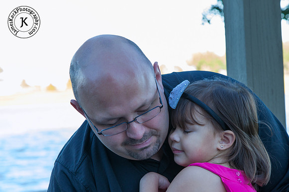 Portrait of Father Hugging Daughter