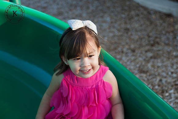 Portrait of Girl Smiling on Slide